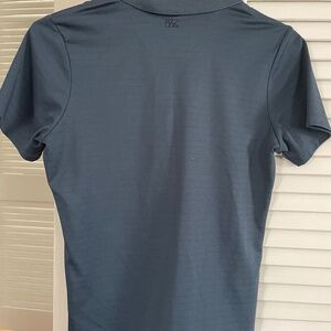 Dark blue charcoal color cutter and buck women’s golf shirt
